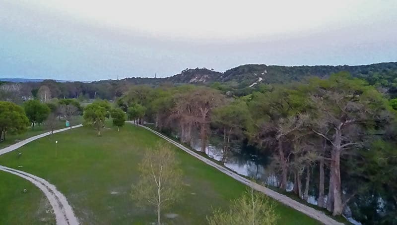 Test flying the drone around a grassy field while learning to slow travel