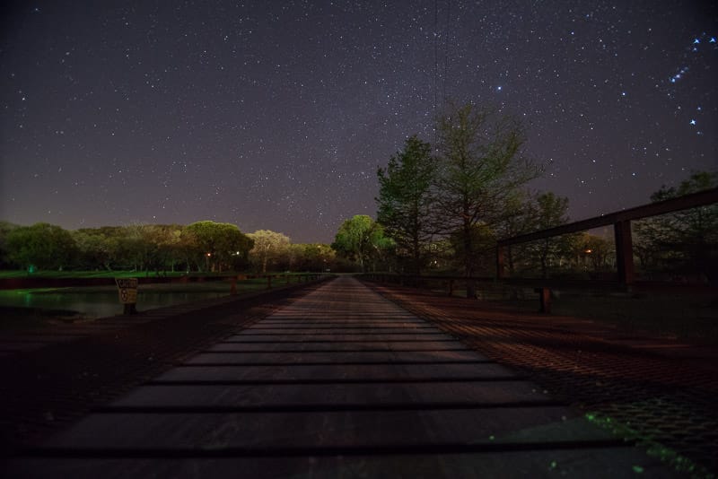 Stars and bridge during a clear night at by the river RV Park in texas