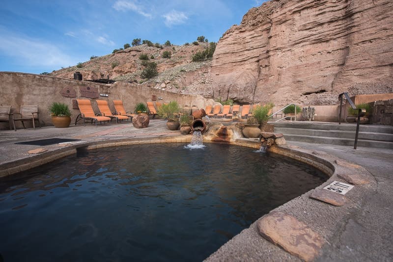 Lovely soaking pool at Ojo Caliente Mineral Springs & Spa with beautiful cliffs