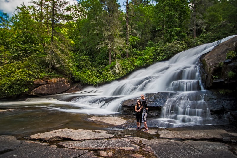 Brooke and Buddy at the base of triple falls in Dupont State Forest north carolina