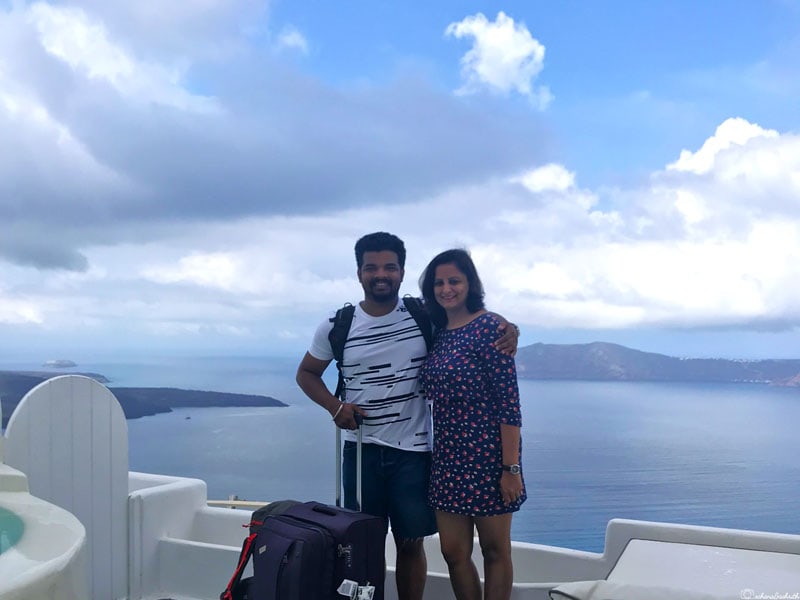 Ashrith and Sahana standing with a trolley suitcase and a daypack