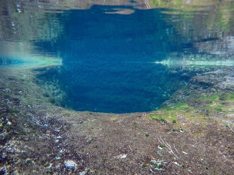 Jacob's well from under the water with the top of the water reflecting down