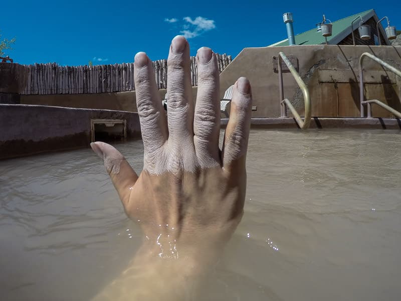 Brooke's hand with some mud on it during our mud bath