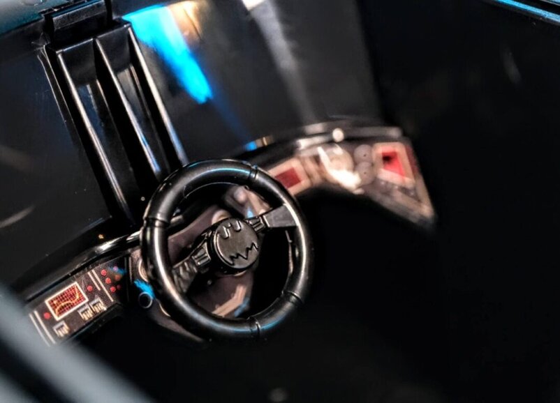 Close-up of DC Multiverse Rebirth Batmobile cockpit and steering wheel by McFarlane Toys.