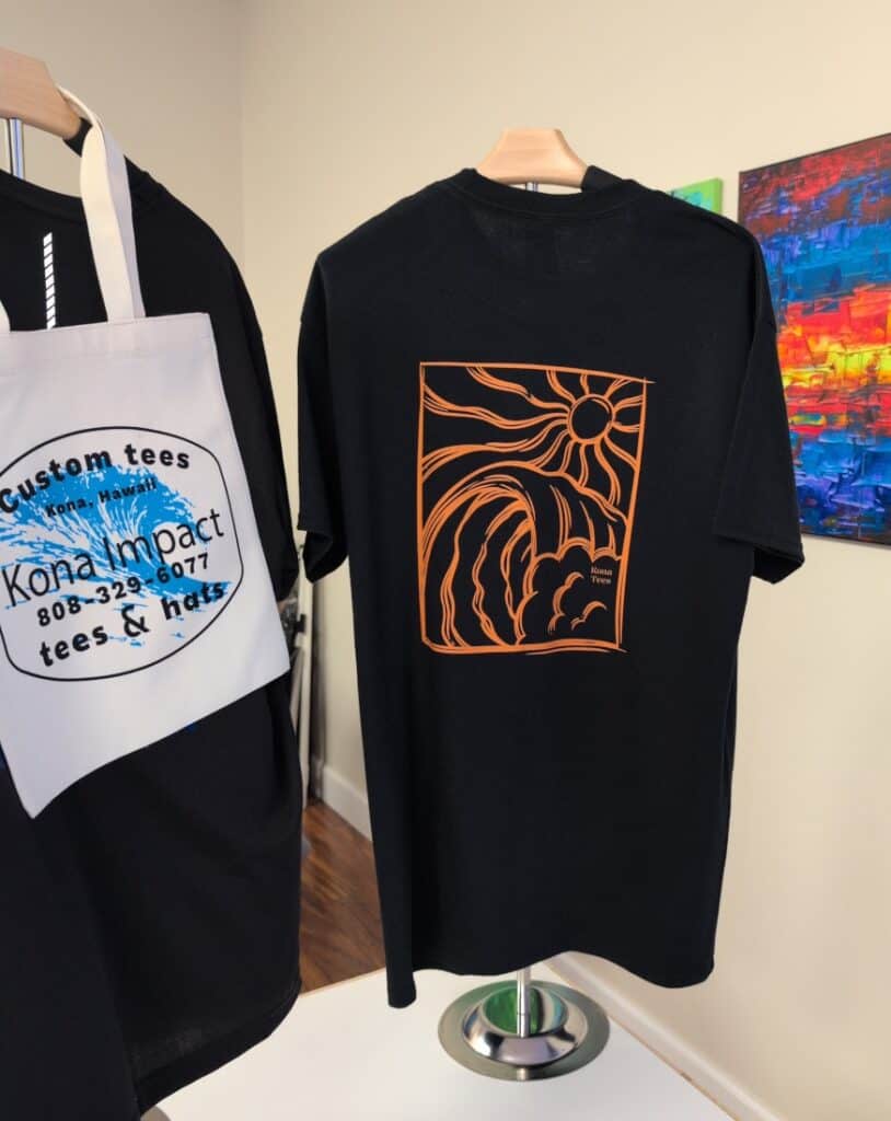 Kona Impact Hawaii T-shirt with surf design and custom Hawaiian apparel.