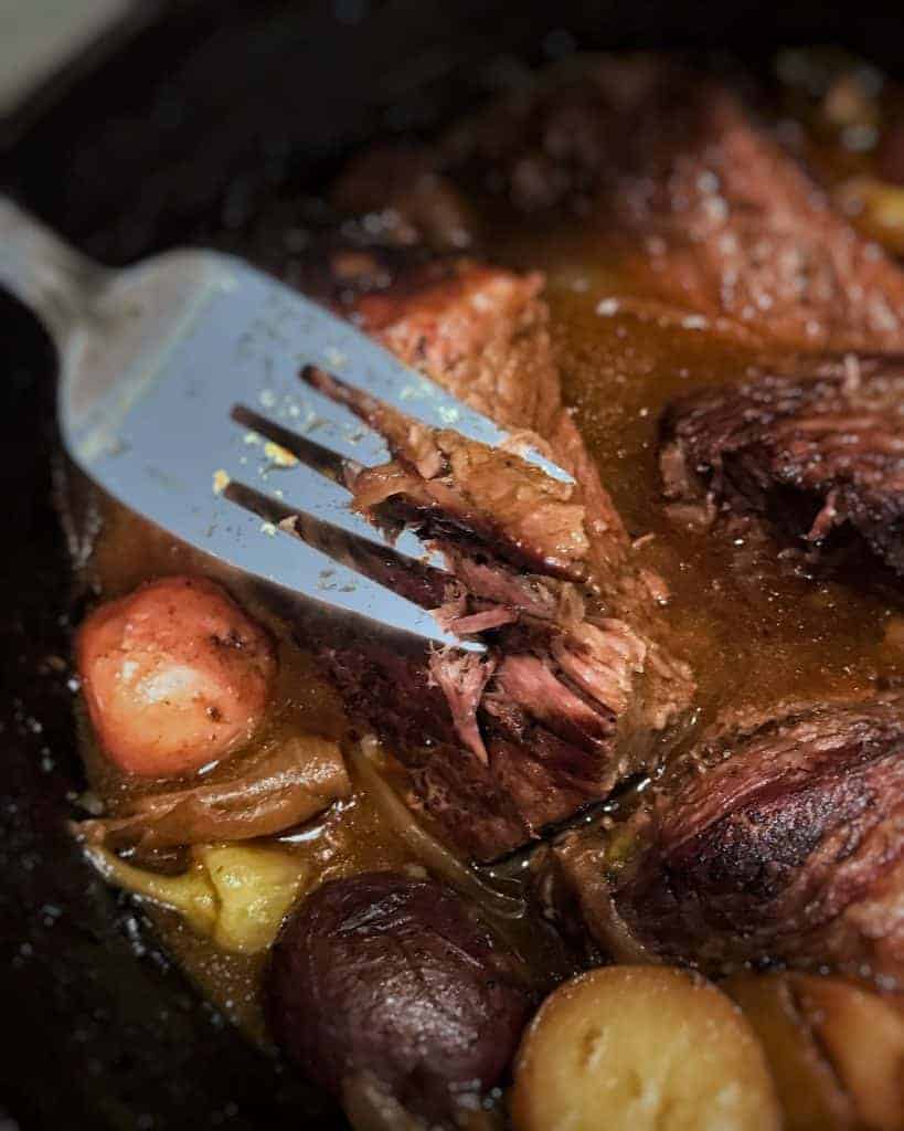 fork with pot roast and vegetables