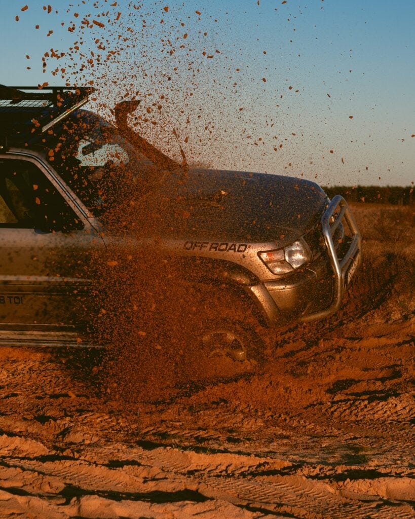 Truck driving through sand