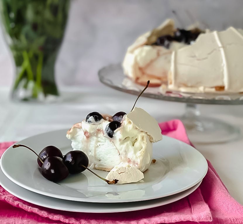 cherry pavlova slice on a plate