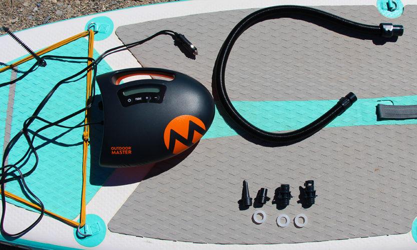 The Outdoor Master Shark Electric SUP Pump with everything included in the box, minus the paddle board.