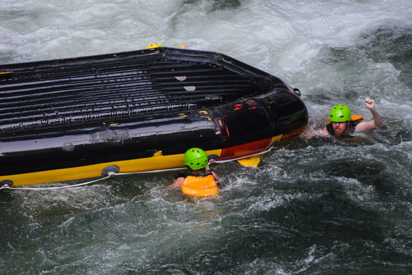 flipping over tutea falls on new zealand rafting trip with kaituna cascades