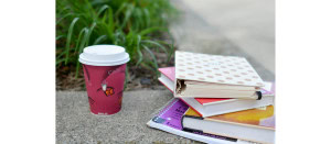 Coffee cup with school books