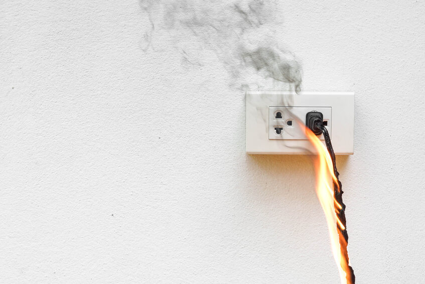 Canada: Switch from fossil fuels to clean electricity | An image of an electrical outlet on fire