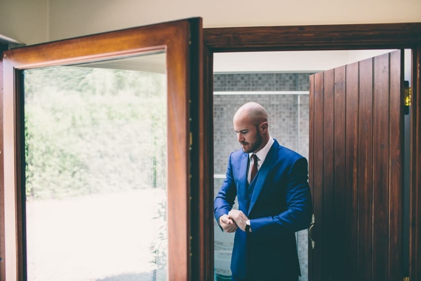 Groom getting ready on wedding day