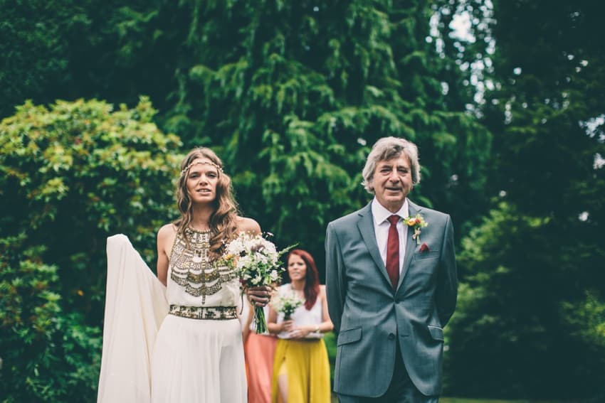 Bride and father of the bride walking to church