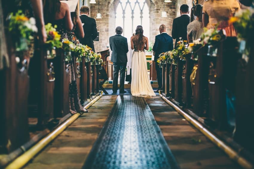 Father of the bride and bride at the front of church