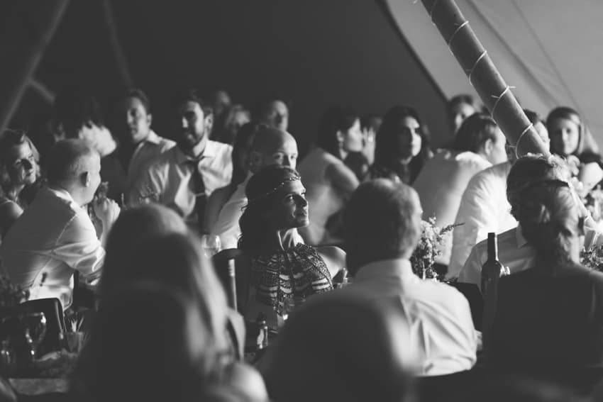 Bride watching father of the bride speech in black and white