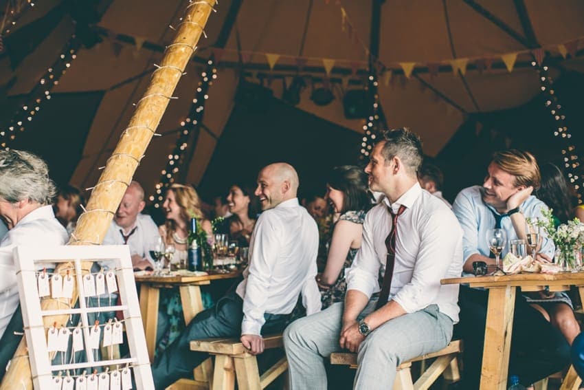 Wedding party and guests in tipi