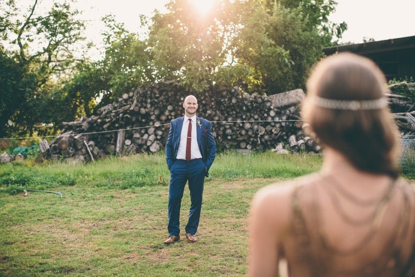 Groom looking at bride in golden sun