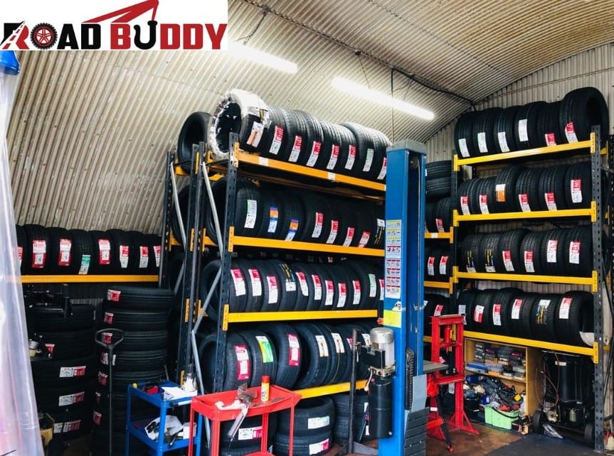 Technician providing tyre repair service at Road Buddy Tyre Shop workshop