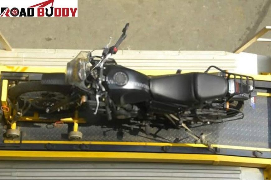 Recovery vehicle transporting broken motorbike from roadside safely