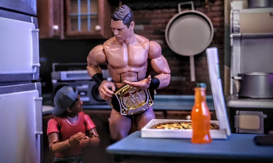 “Figures Toy Company Ultimate Wrestling Fan Ethan talks with WWE Mattel Elite The Miz action figure over pizza and soda in a kitchen diorama”