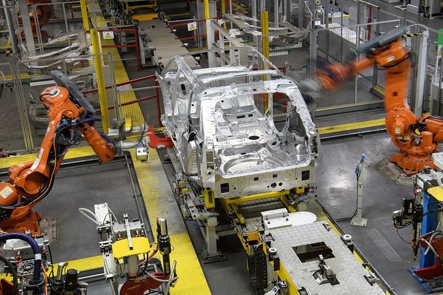 SOLIHULL, ENGLAND - MARCH 06: Robotic systems work on the chassis of a car during an automated stage of production at the Jaguar Land Rover factory on March 1, 2017 in Solihull, England. The company has pledged it's 'heart and soul' to production in the UK after producing the new "Velar" model for global sale, at their Solihull factory. (Photo by Leon Neal/Getty Images)