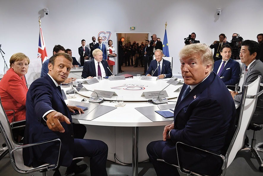BIARRITZ, FRANCE - AUGUST 25: France's President Emmanuel Macron and US President Donald Trump pose for the media as they meet for the first working session of the G7 Summit on August 25, 2019 in Biarritz, France. The French southwestern seaside resort of Biarritz is hosting the 45th G7 summit from August 24 to 26. High on the agenda will be the climate emergency, the US-China trade war, Britain's departure from the EU, and emergency talks on the Amazon wildfire crisis. (Photo by Jeff J Mitchell - Pool /Getty Images)
