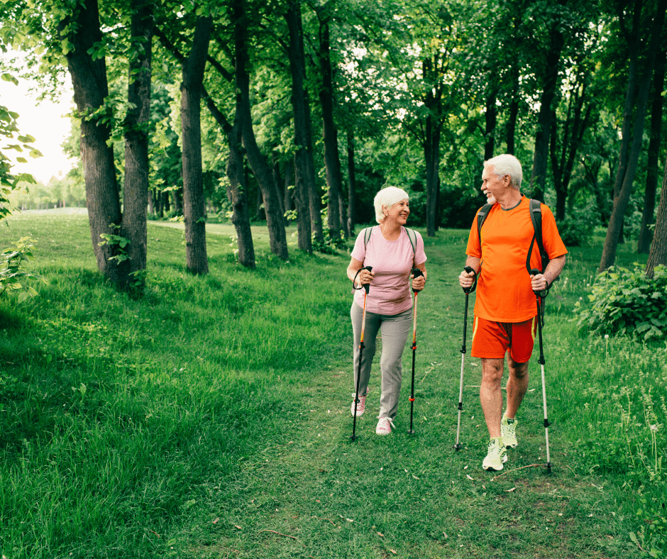 A senior couple walking in the forest