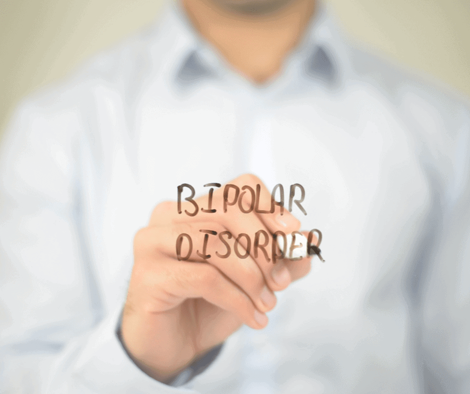 A man writing "Bipolar disorder" word