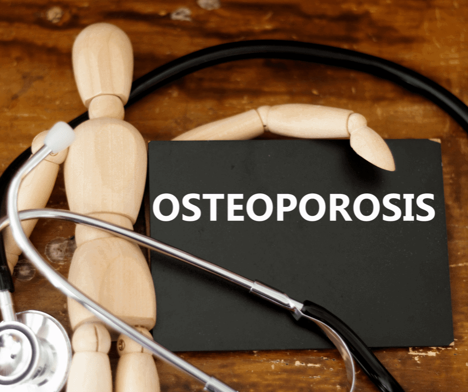 A dummy with stethoscope and the word of osteoporosis