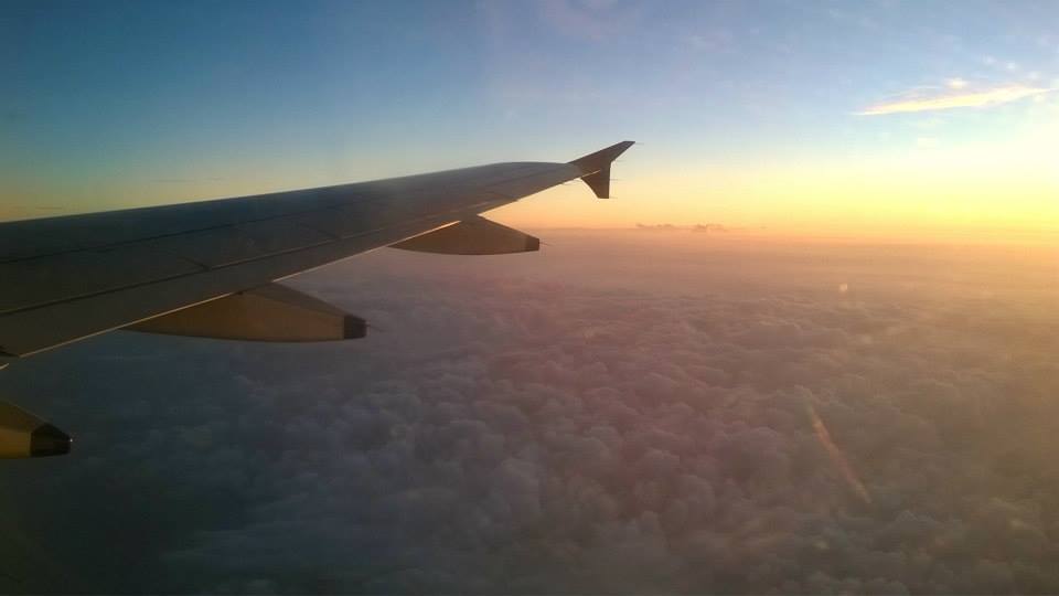 a flight above the clouds during sunset during travel to gujarat