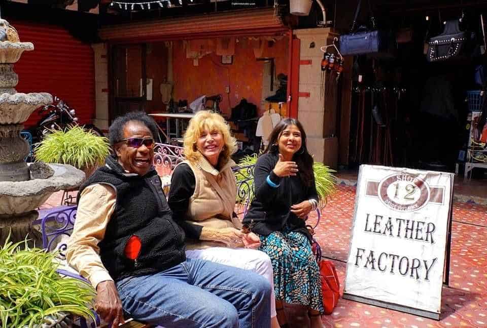 Travel Careers and Learning Internationally 2 Shopping South Of The American-Mexican Border In Photos - A group of people sitting posing for the camera - ExploreTraveler