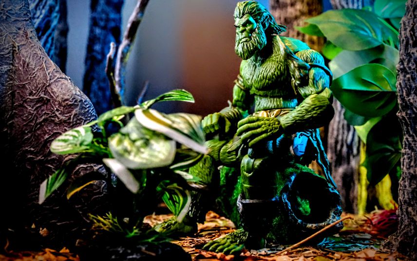 Masters of the Universe Masterverse New Eternia Moss Man JCC47 action figure seated in forest diorama