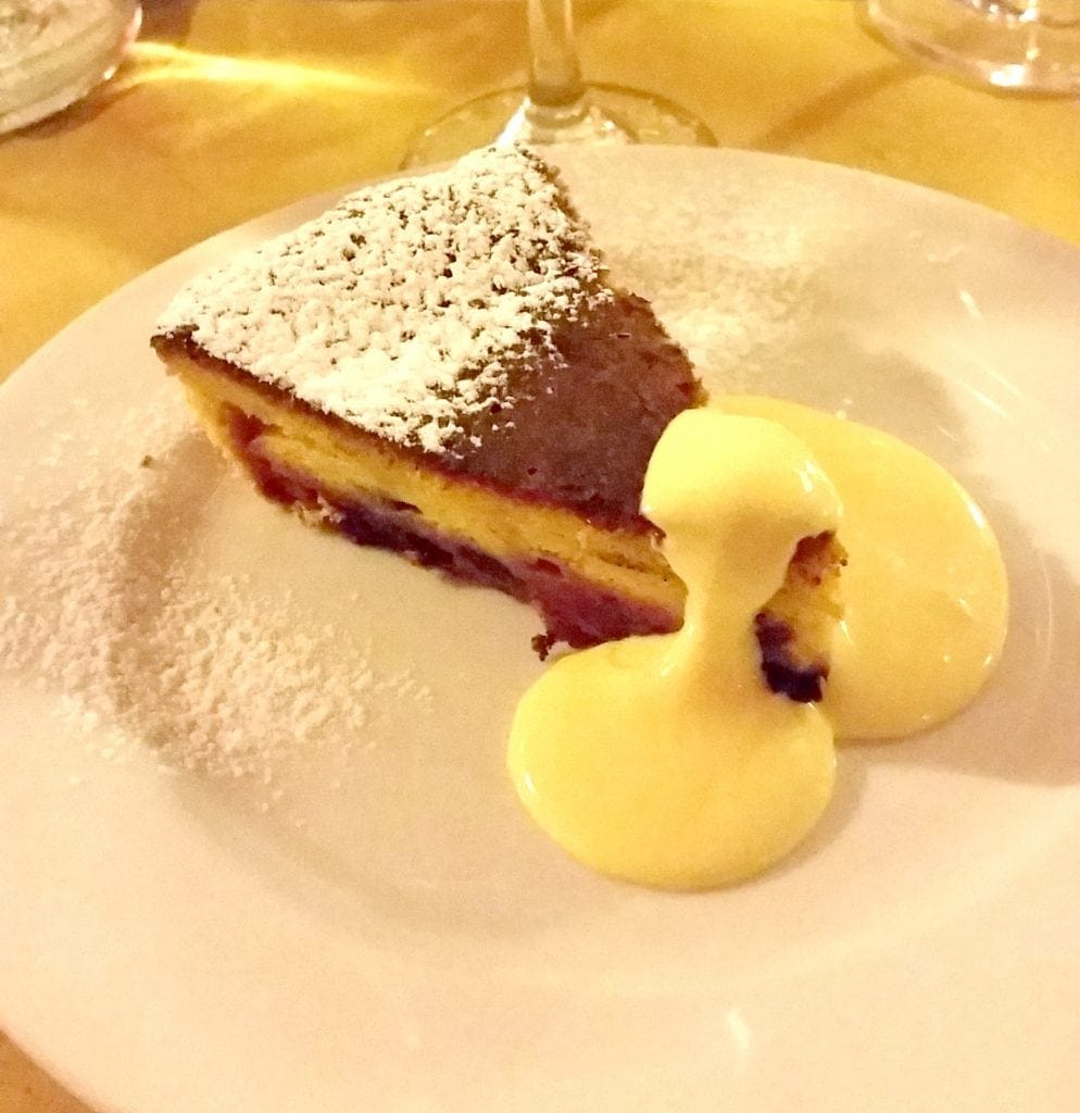 slice of berry cake finished with French cream sauce