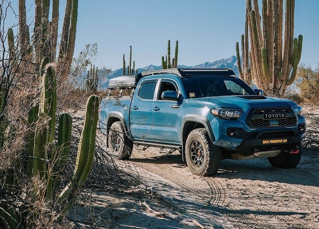 Body Armor 4x4 HiLine Series front bumper on blue Tacoma TRD Pro