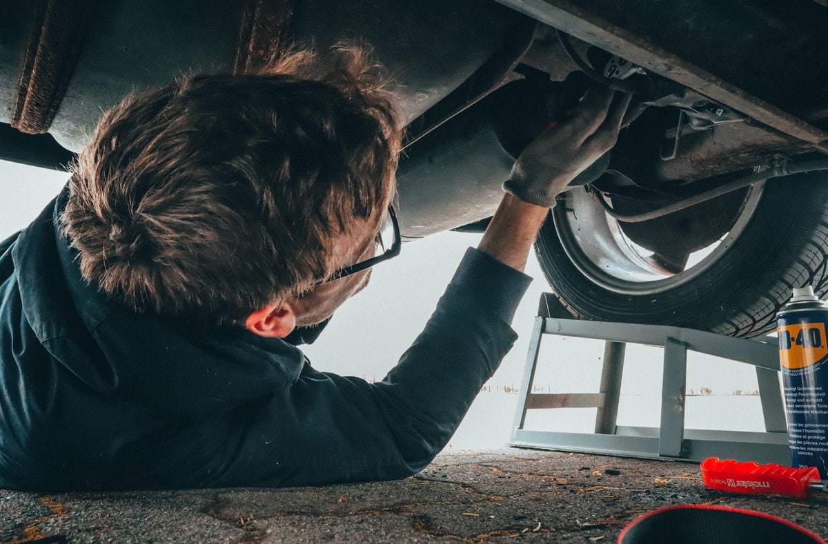 Mechanic working under a vehicle