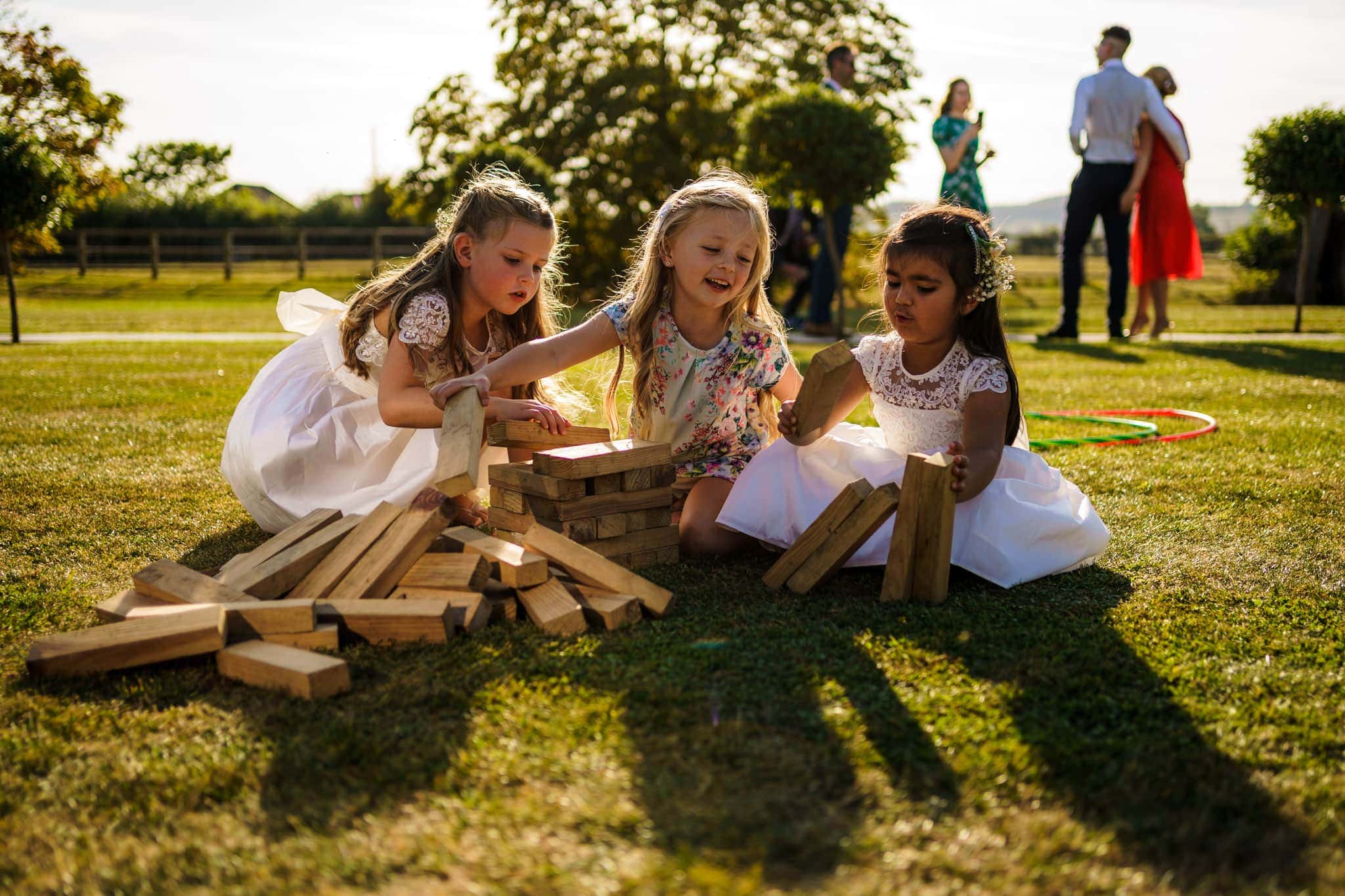 young girls playing with Jenga blocks