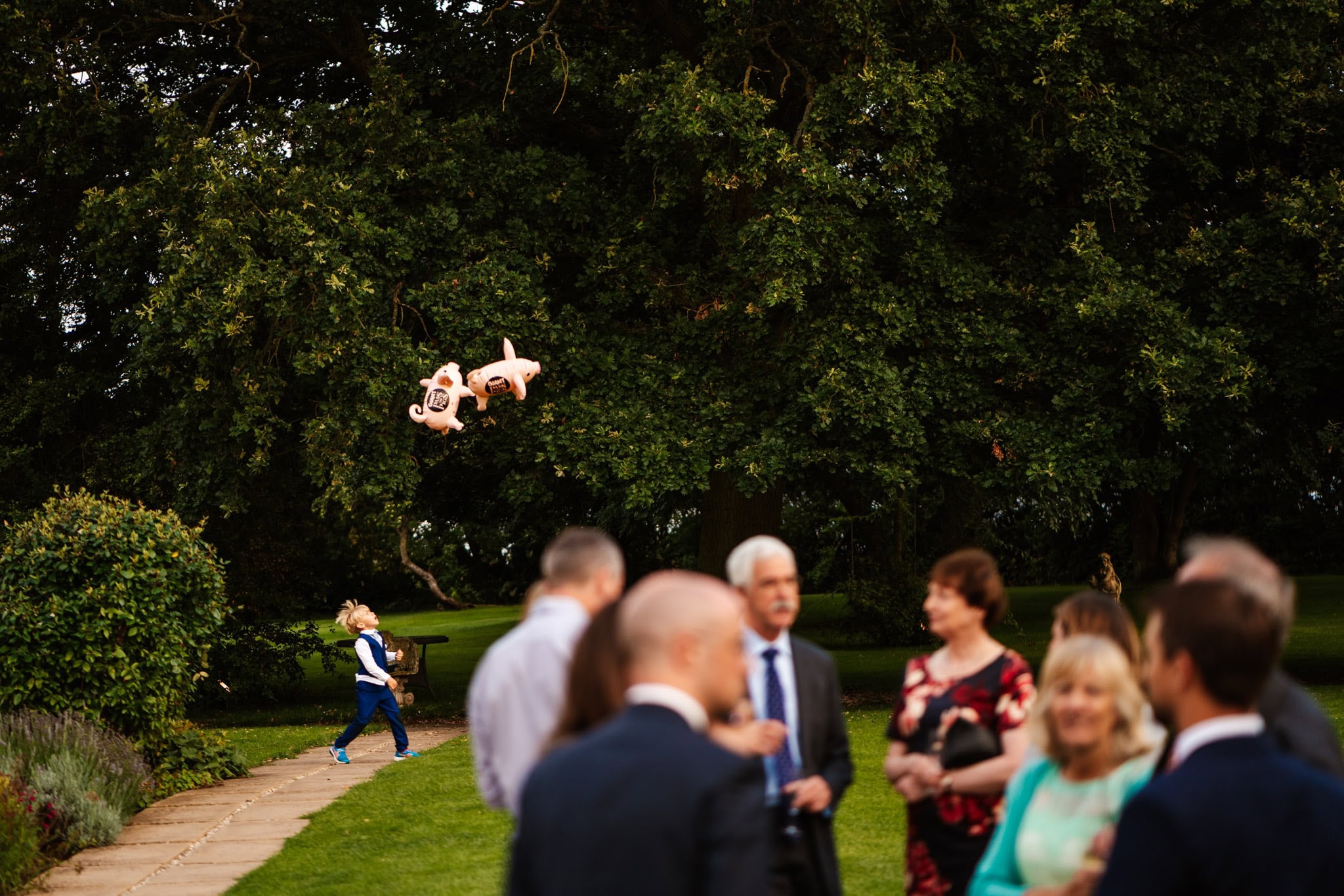 boy throwing inflatable pigs in the air at Wethele Manor