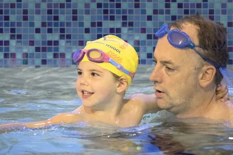 Toddler and parent bonding in a swimming class in Wimbledon Southwest London