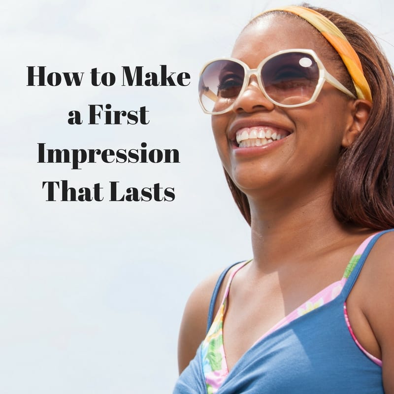 Smiling Black woman wearing sunglasses and a blue top, representing confidence and making a lasting first impression in dating.
