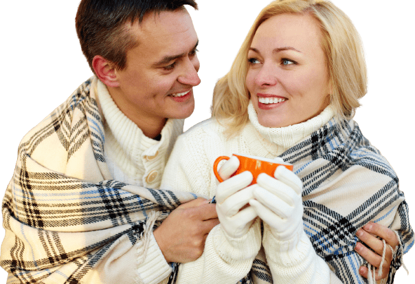 man giving woman coffee on a cold winter day