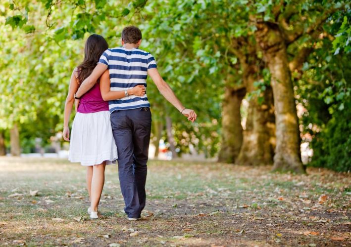 Beautiful loving couple going for a walk outdoors