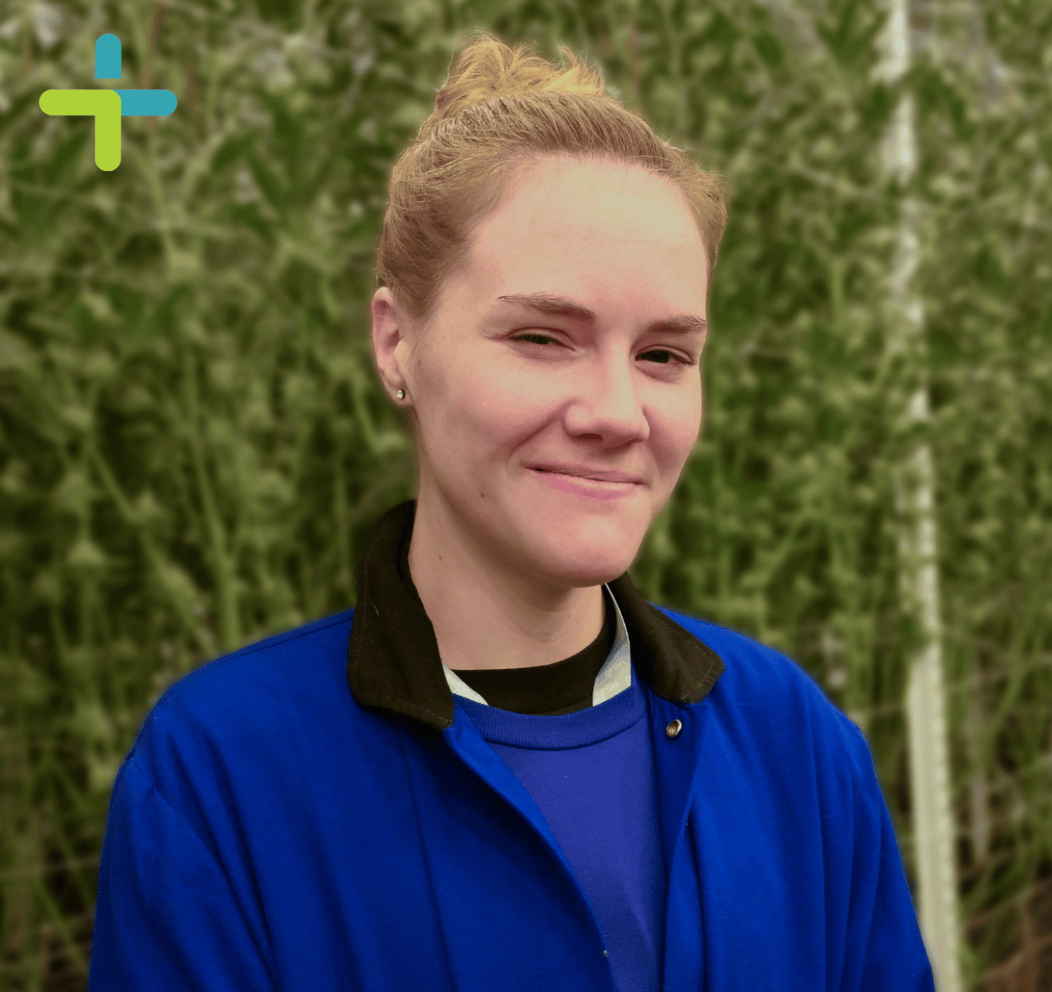 Allison in front of cannabis plants.