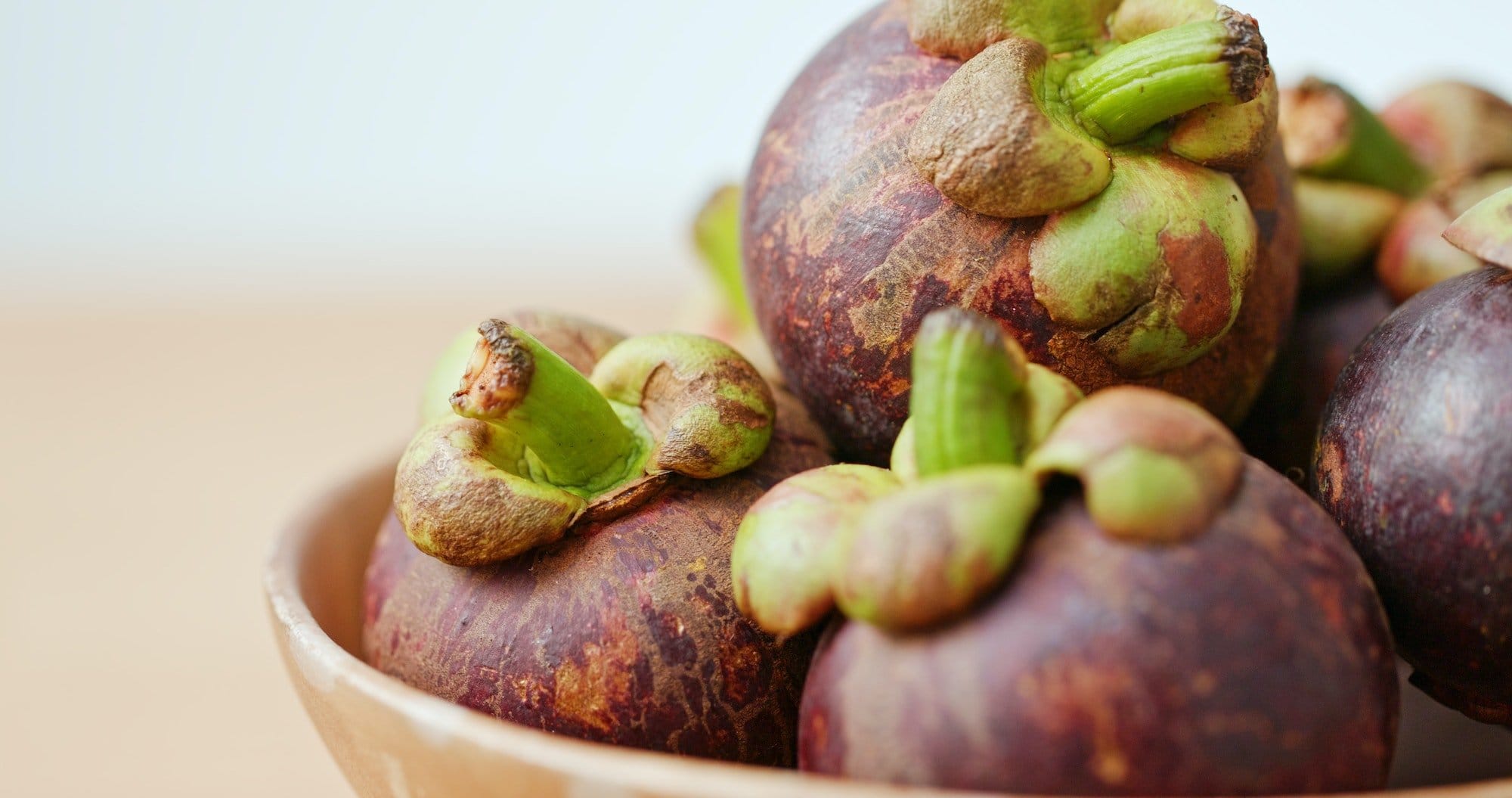 Purple mangosteen on wooden table