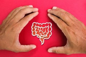 hand making a bracket with a gut icon in the middle