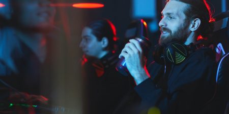 Satisfied gamer drinking energy beverage