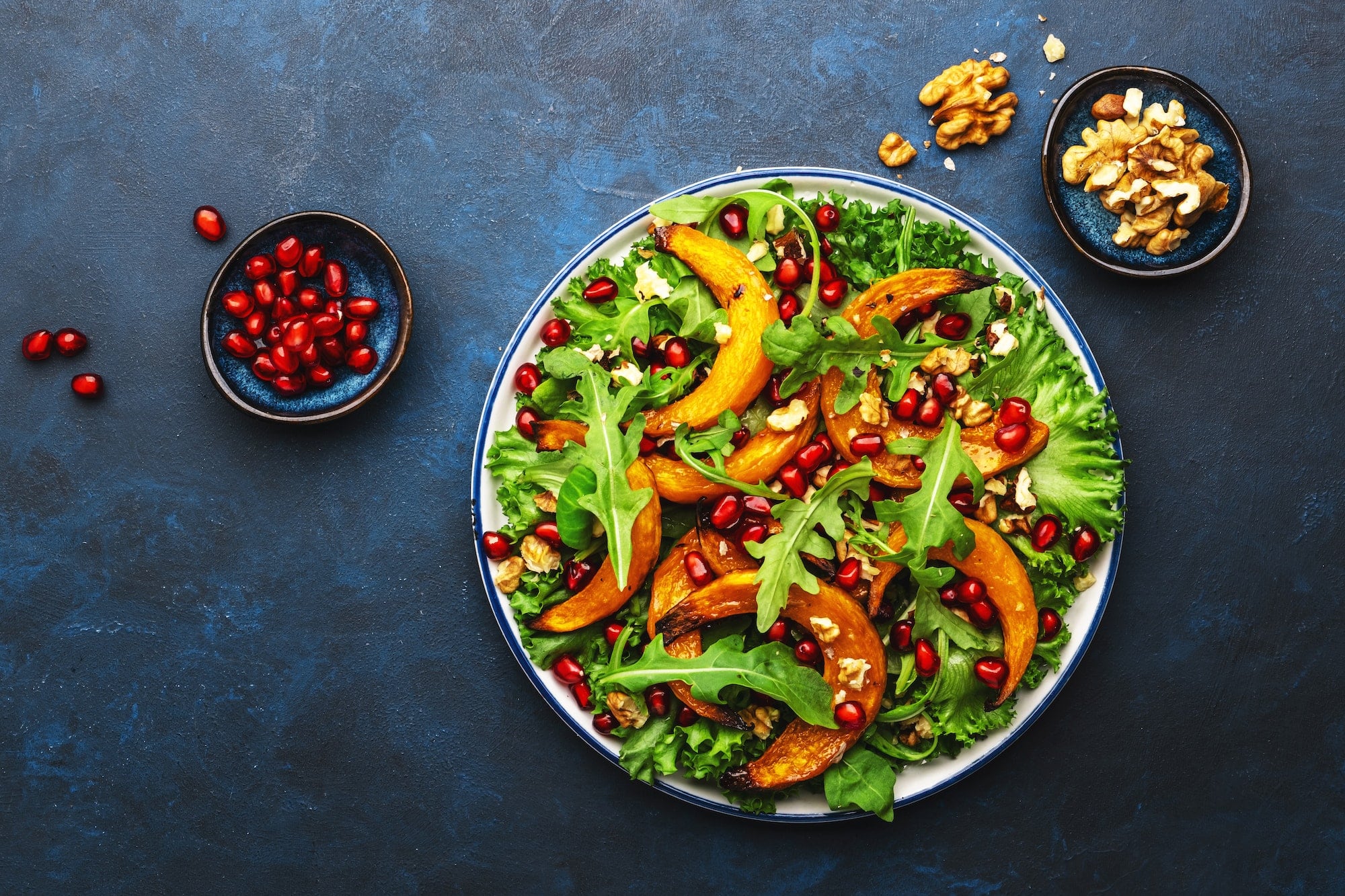 Healthy vegan eating, autumn pumpkin salad with baked honey pumpkin slices