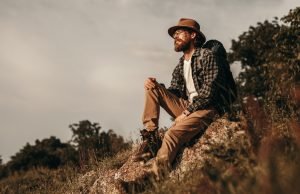 Relaxed thoughtful male traveler enjoying natural landscape
