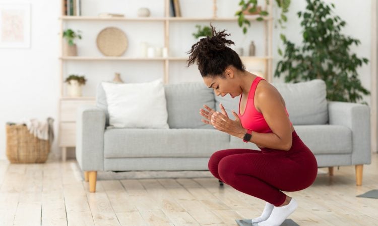Black Lady Shouting Standing On Weight-Scales After Weight Gain Indoor