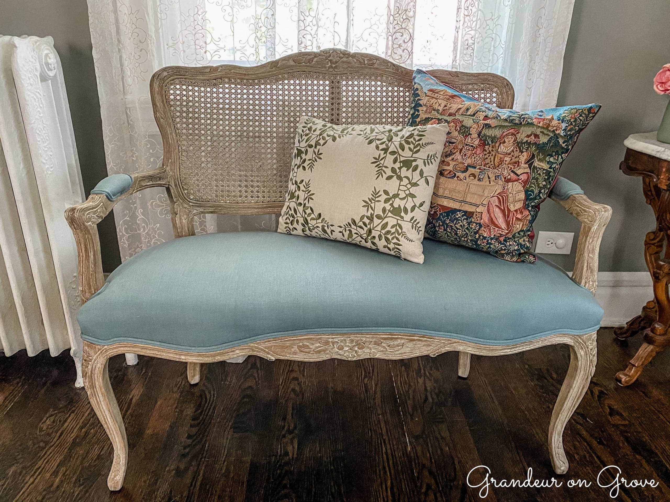 A French style bench with throw pillows